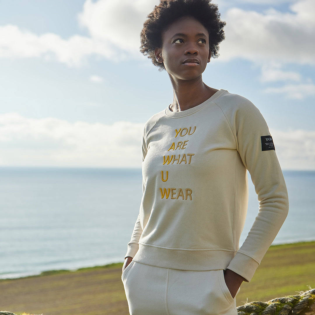 Womens ivory organic cotton sweatshirt with yawuw slogan.