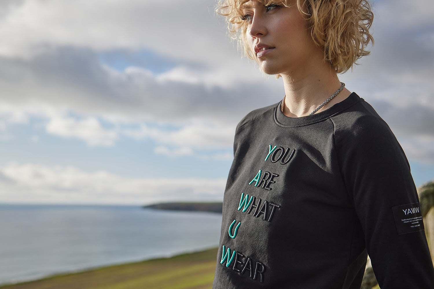 Womens black semi fitted crewneck sweatshirt, made ethically and from organic cotton and recycled polyester.  Designed in Ireland. 