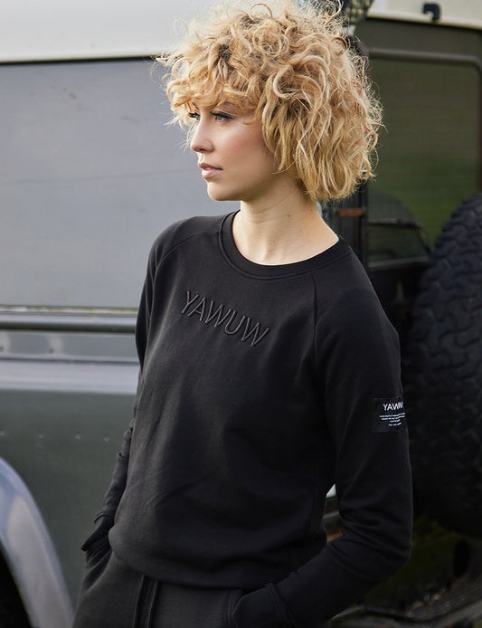 Womens black semi fitted crewneck sweatshirt with YAWUW logo, made from organic cotton and recycled polyester.